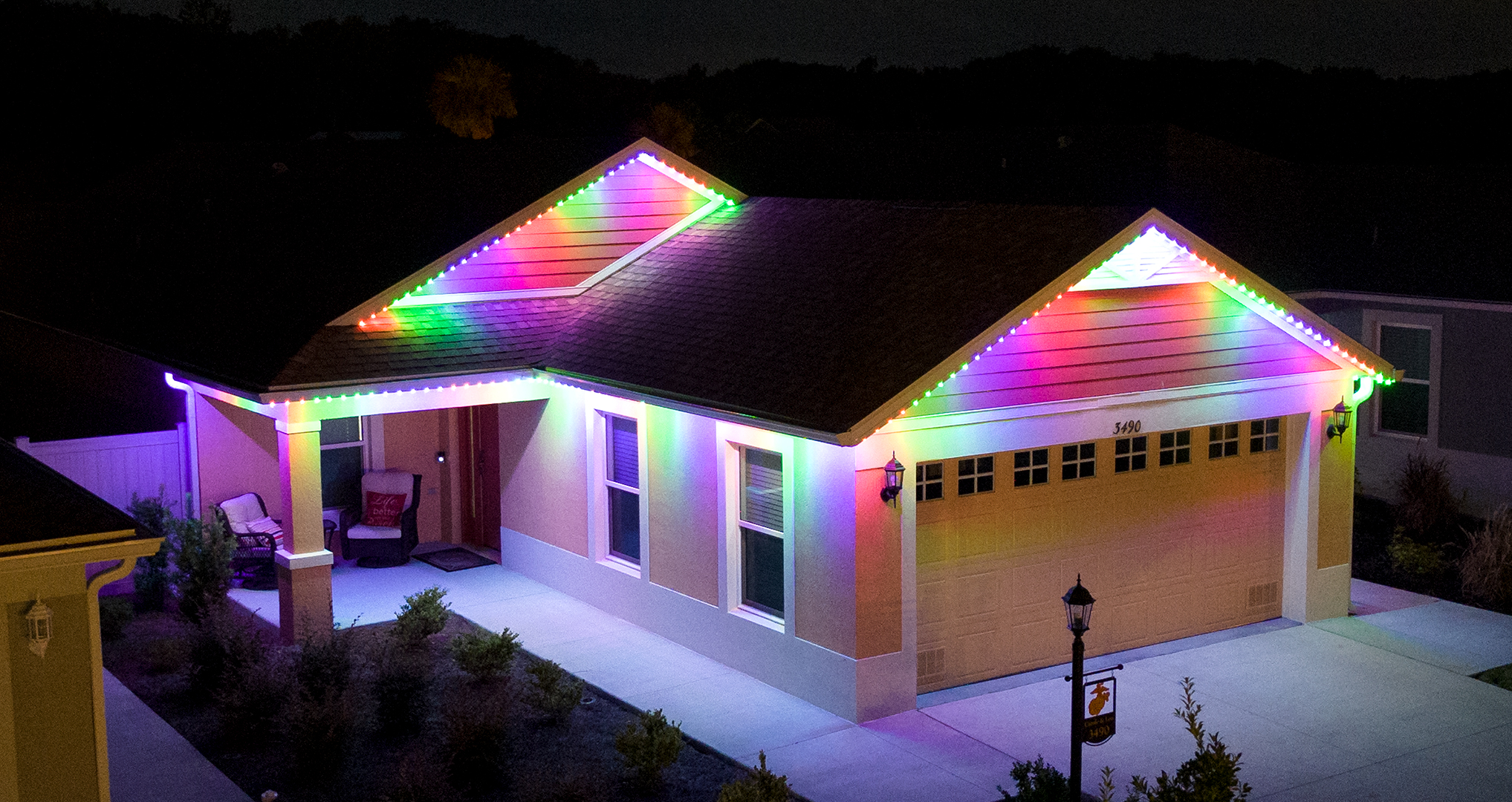Multicolor permanent roofline lighting on a home in The Villages Multicolor permanent roofline lighting on a home in The Villages